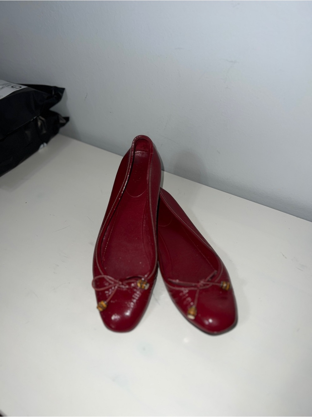 GUCCI Red Leather Ballet Flats with Decorative Bead Accent